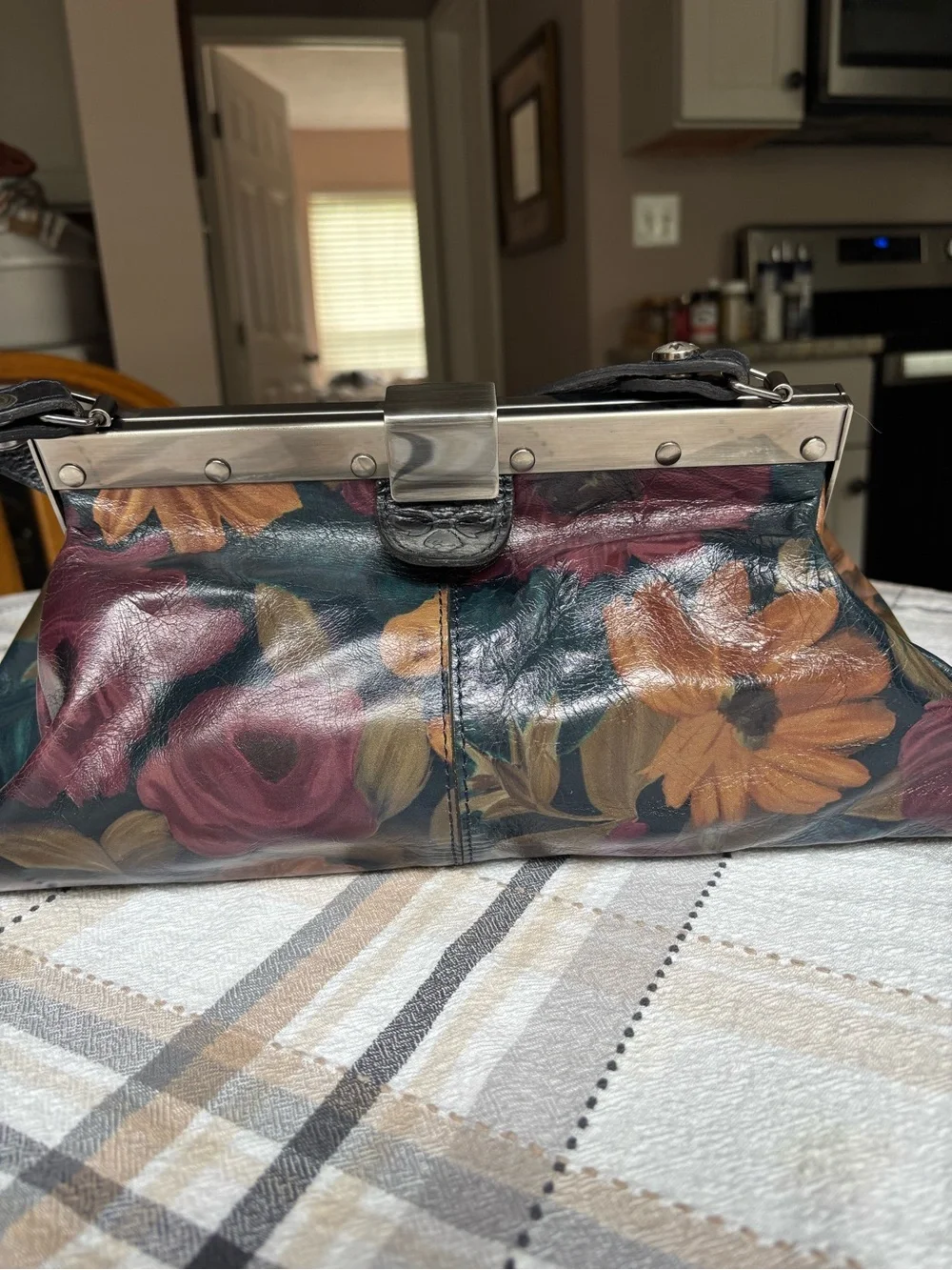 Patricia Nash Ferrara satchel purse. Dark multicolored floral leather print